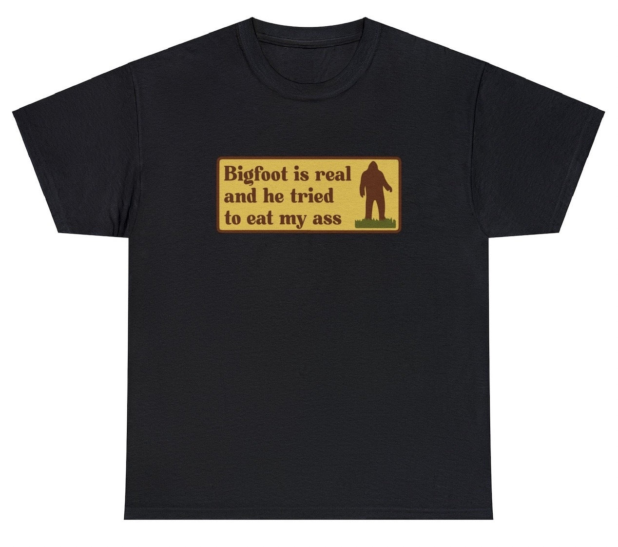 "Funny 'Bigfoot Tried To Eat My Ass' t-shirt featuring bold humor and cryptid-themed design, perfect for fans of quirky humor and Bigfoot."