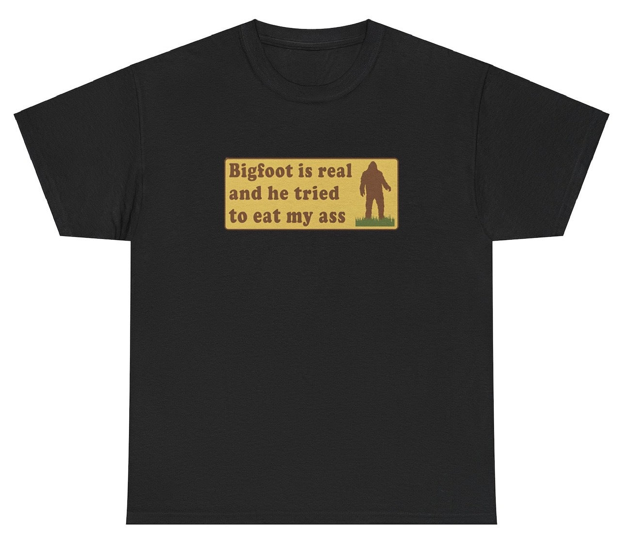 "Funny 'Bigfoot Is Real And Tried To Eat My Ass' t-shirt, perfect for cryptid fans and bold humor lovers. Great for casual wear and gag gifts."