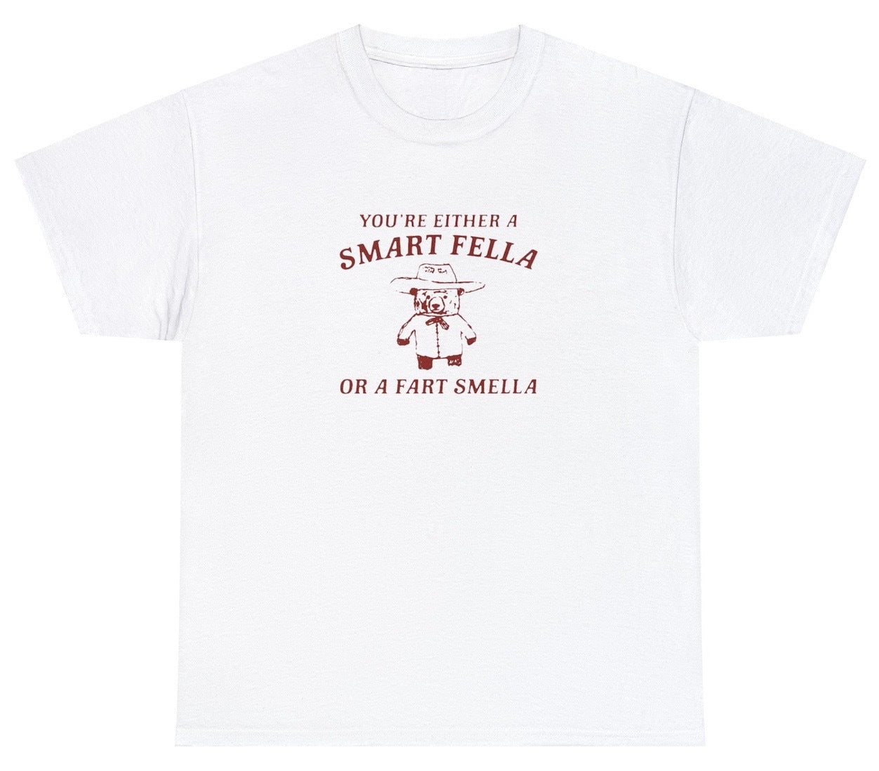 "Cheeky 'Are You A Smart Fella Or Fart Smella' t-shirt, perfect for fans of witty wordplay and lighthearted humor. Ideal for casual wear and fun gifts."
