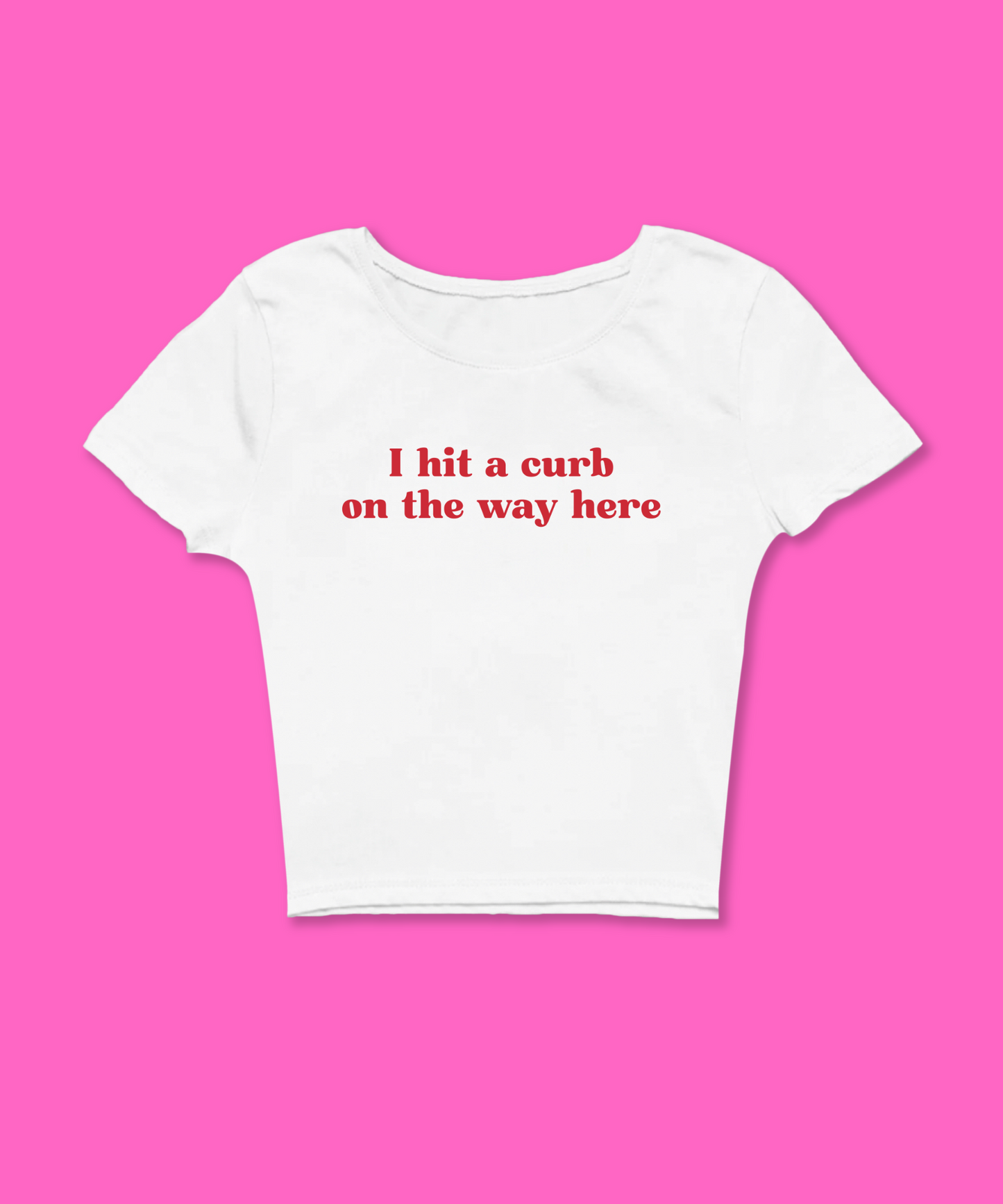 I Hit A Curb On The Way Here Baby Tee featuring a bold graphic and Y2K aesthetic. This funny baby tee is a women’s crop top available as a white baby tee, perfect for those who love graphic baby tees and Y2K baby tee fashion.