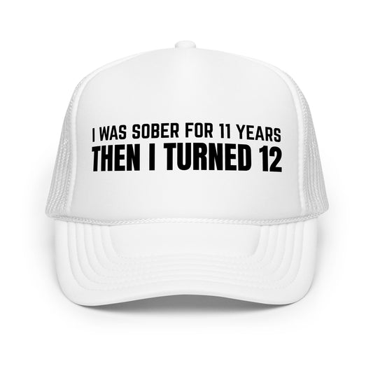 Funny drinking trucker hat with bold white text that says “I Was Sober For 11 Years Then I Turned 12” — a hilarious mesh-back hat for men who love beer hats, inappropriate jokes, and crazy humor at parties or tailgates.