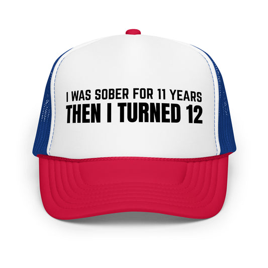 Funny drinking trucker hat with bold white text that says “I Was Sober For 11 Years Then I Turned 12” — a hilarious mesh-back hat for men who love beer hats, inappropriate jokes, and crazy humor at parties or tailgates.