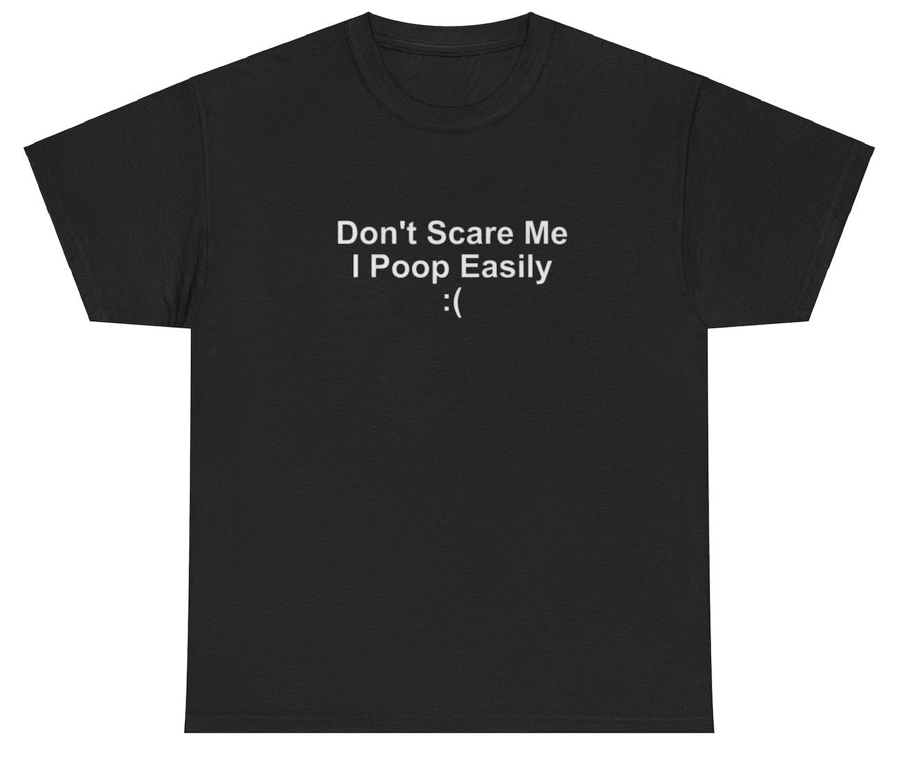 "Funny 'Don't Scare Me I Poop Easily' t-shirt, perfect for fans of playful humor and viral memes. Great for casual wear and gag gifts."