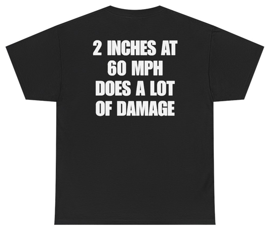 Funny 2 Inches At 60 MPH Does A Lot Of Damage Tee (BACKPRINT) T-Shirt featuring bold sarcastic humor and graphic design, perfect for casual wear and humor lovers