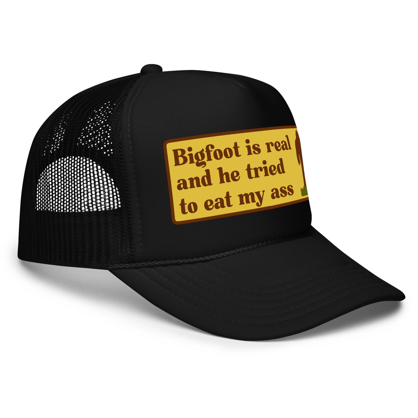 Funny inappropriate trucker hat with bold text that says “Bigfoot Is Real And He Tried To Eat My Ass” — a hilarious mesh-back hat for men who love crazy hats, weird humor, and legendary funny hat sayings perfect for parties or festivals.

