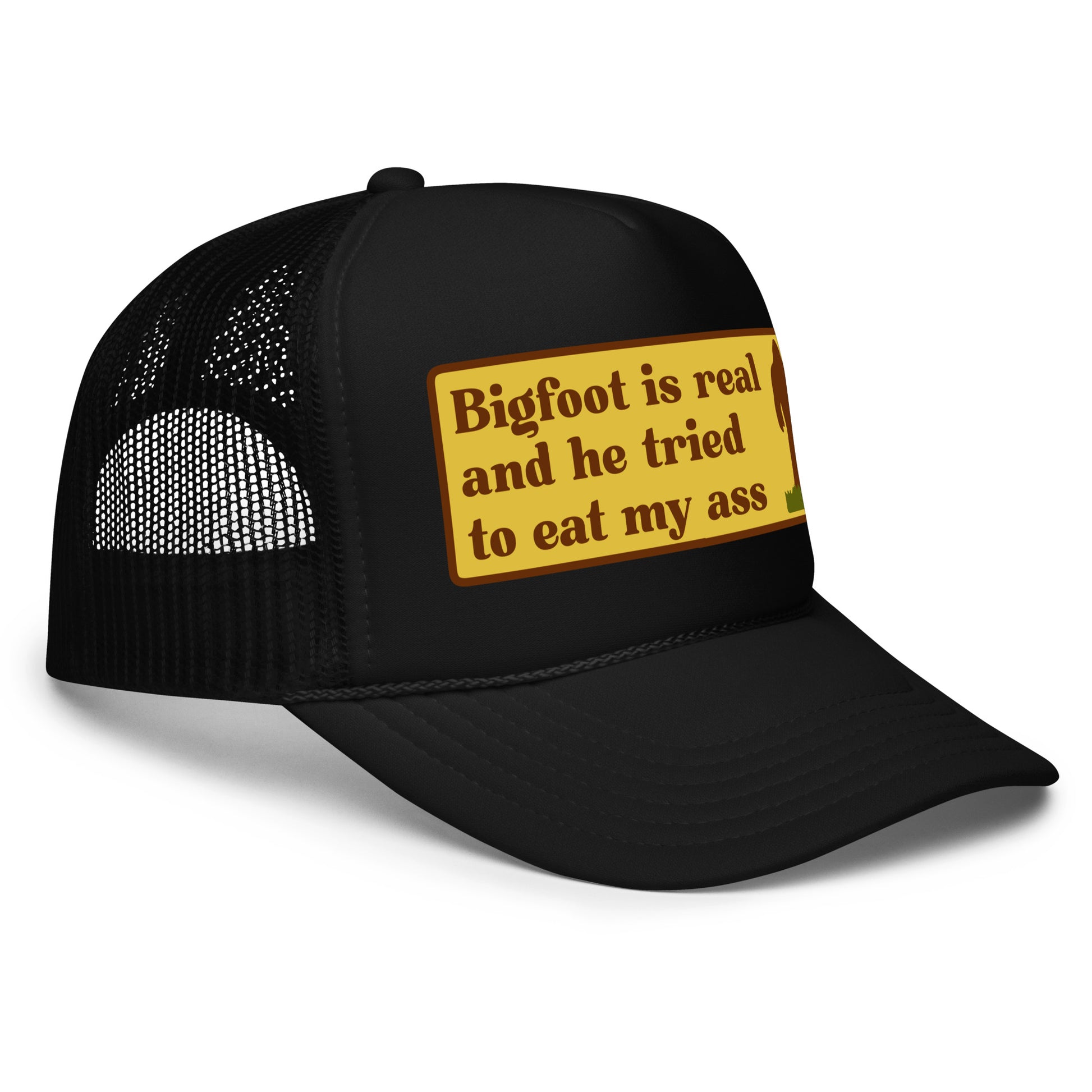 Funny inappropriate trucker hat with bold text that says “Bigfoot Is Real And He Tried To Eat My Ass” — a hilarious mesh-back hat for men who love crazy hats, weird humor, and legendary funny hat sayings perfect for parties or festivals.

