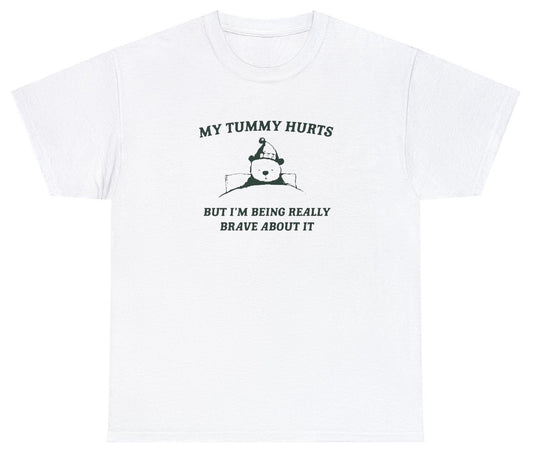 "Playful 'My Tummy Hurts But Really Brave About It' t-shirt, perfect for fans of quirky and relatable humor. Ideal for casual wear and fun gifts."

