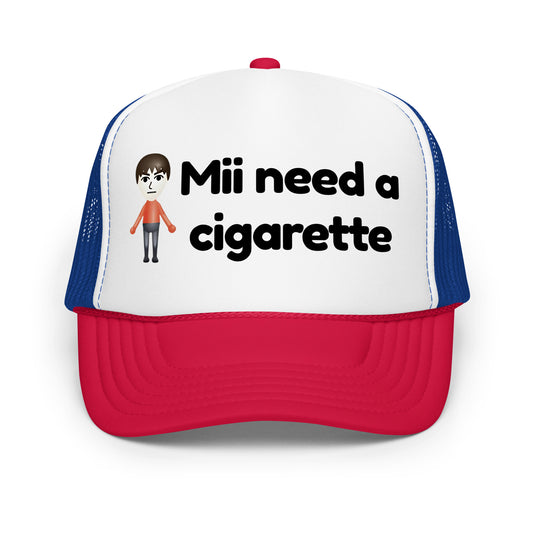 Crazy funny trucker hat for men with bold text that says “Mii Need A Cigarette” — a hilarious drinking hat with mesh back, perfect for fans of unhinged humor, viral sayings, and bold party energy.

