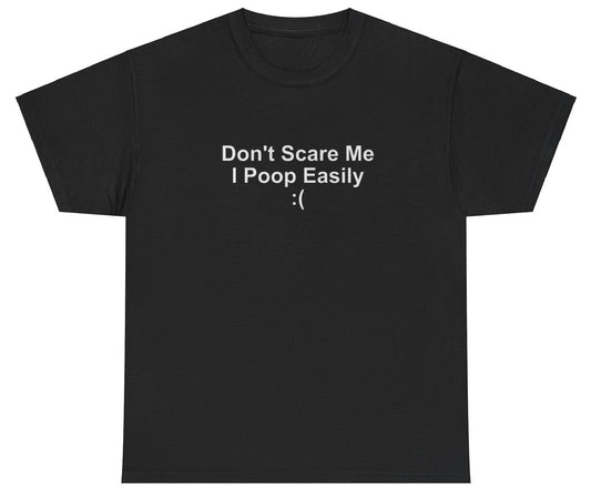 "Funny 'Don't Scare Me I Poop Easily' t-shirt, perfect for fans of playful humor and viral memes. Great for casual wear and gag gifts."